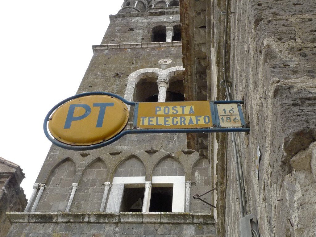 Old post office sign near a church
