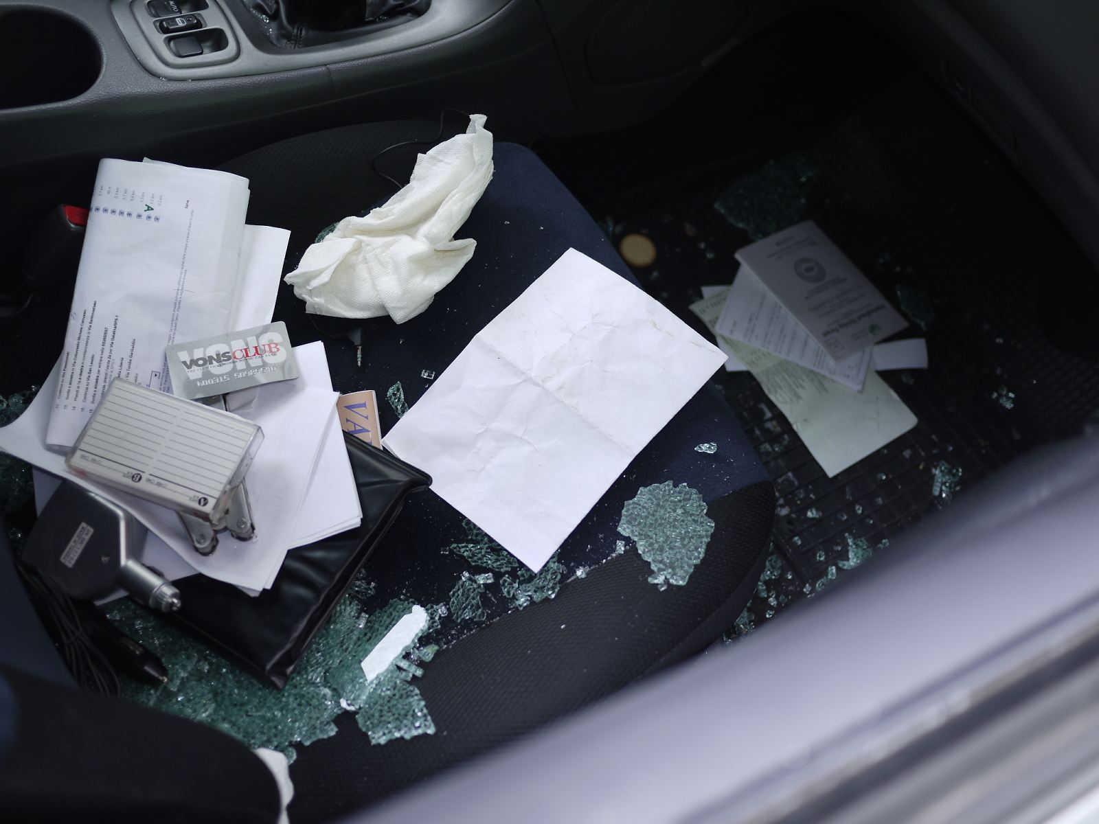 Shards of broken windows on the passenger's side seat