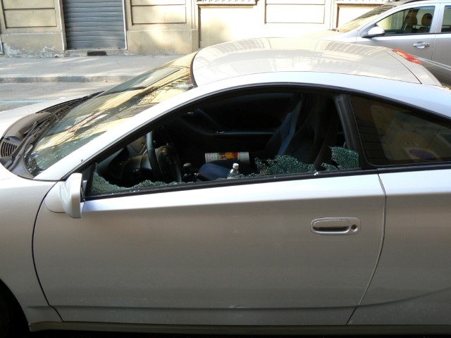 Smashed windows on a car from a break-in in Turin Torino Italy