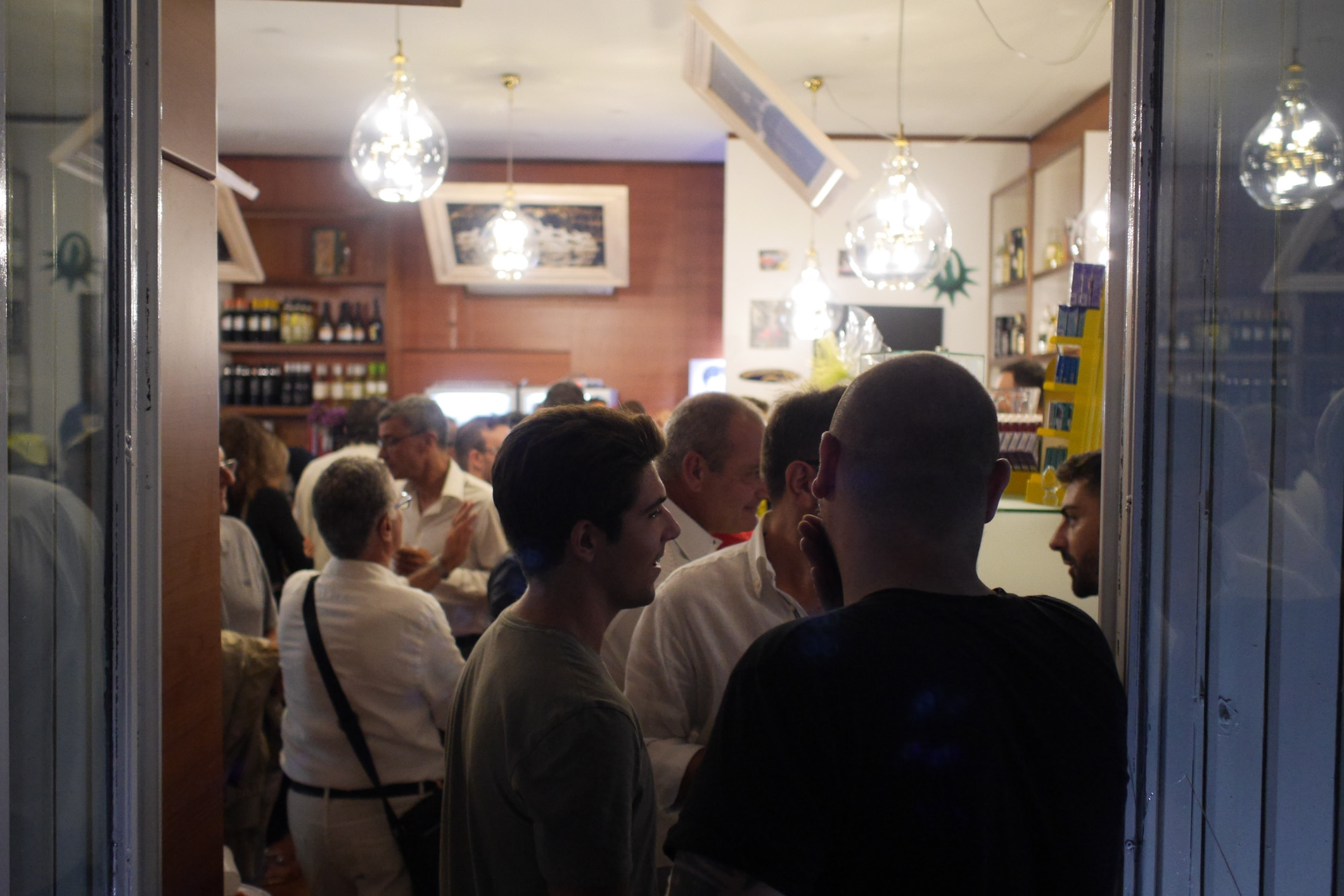 A restaurant with many people inside