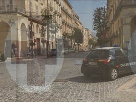 Composition of empty Italian city piazza and hospital sign
