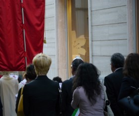 A crowd walking in a Italian city